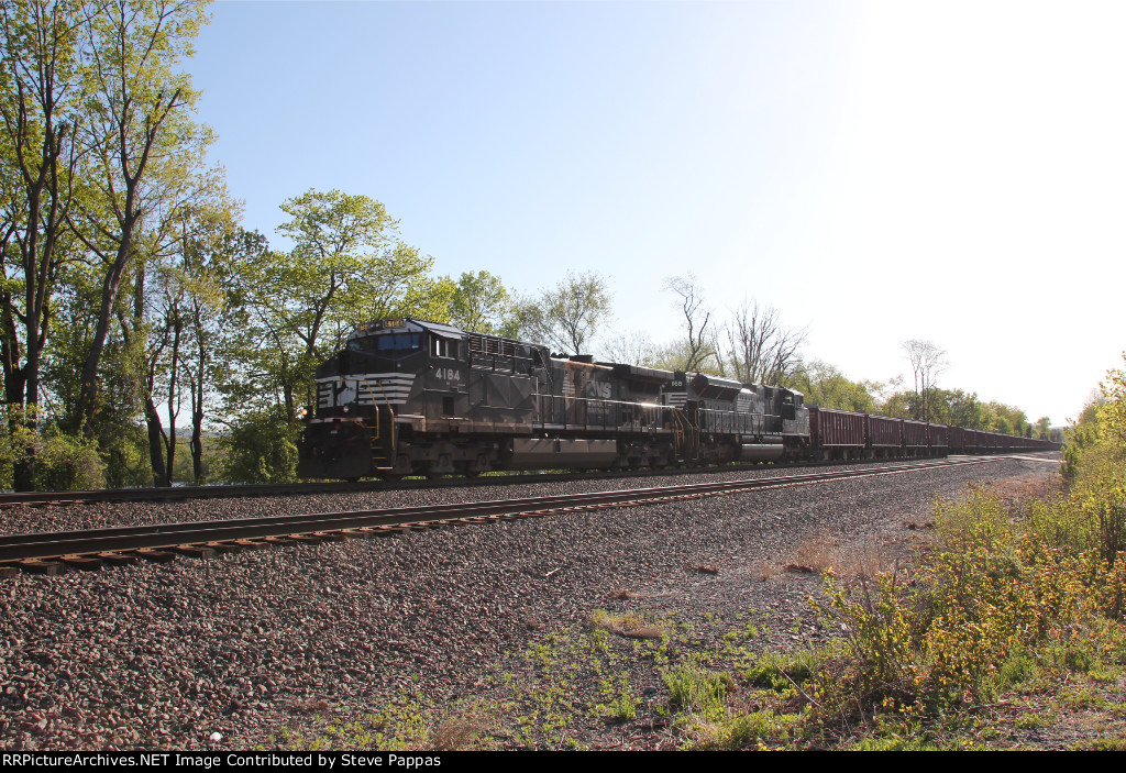 NS 4184 leads a ballast train west through milepost 116 at Cove PA